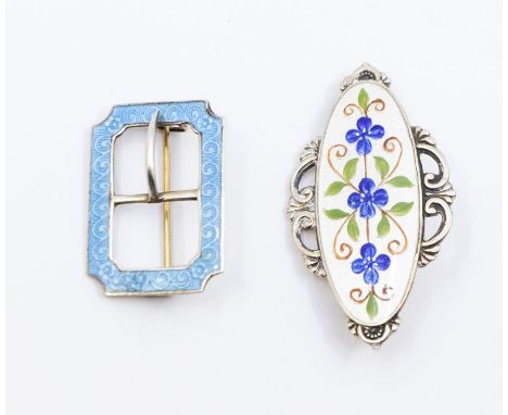 Two early 20th century enamel brooches, comprising a silver gilt (faded) oval brooch with scrolled border with blue enamel fl