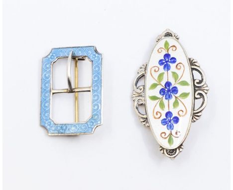 Two early 20th century enamel brooches, comprising a silver gilt (faded) oval brooch with scrolled border with blue enamel fl