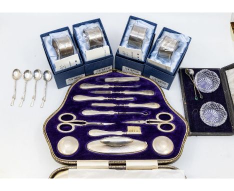 A collection of silver to include: 1. a matched early 20th Century hallmarked engine turned cased manicure set, Birmingham, 1
