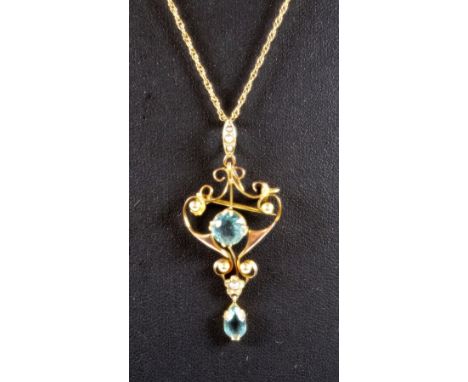 Yellow metal openwork pendant set 2 synthetic aquamarines and seed pearl, stamped 9ct., on a fine chain, gross 4grs 