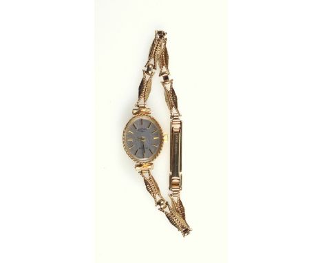 Lady?s Rotary bracelet watch with a silvered oval dial and baton markers enclosing a quartz movement, in a 9ct. gold case on 