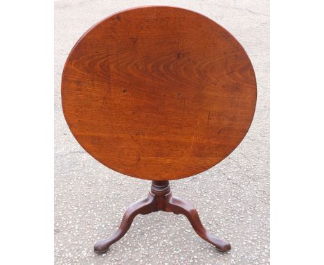 George III mahogany tripod table, the one piece tilt top on a barrel turned tapering support on three out swept legs, 76 cm w