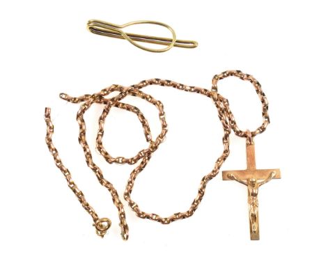 9ct gold crucifix with a gold necklace (broken), strung with a nylon thread, gross weight 13.4 grams, and a gold tie pin stam