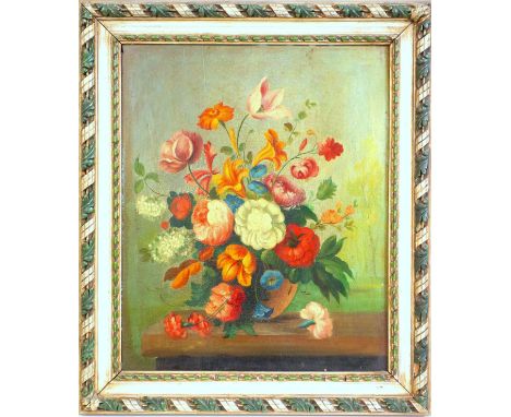 A pair of Still Life paintings of flowers in a vase, resting upon a table, oil on wood panel, unsigned, in carved painted fra