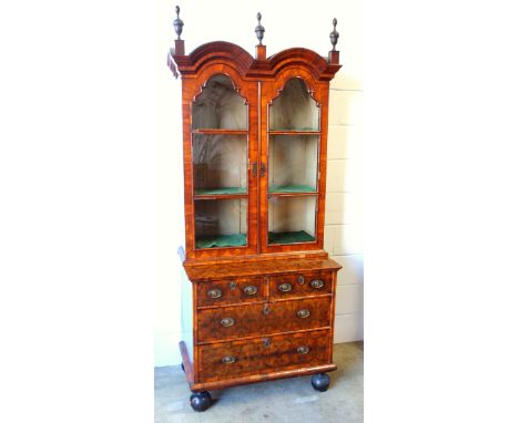 William and Mary walnut and oyster veneered chest with 2 short, 2 graduated long drawers, on later bun feet, with a cabinet a