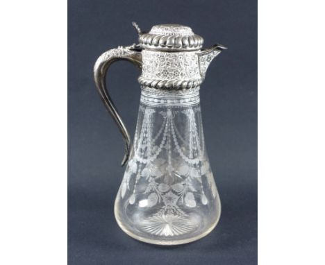 Late Victorian claret jug of tapering circular form, with engraved floral and swag decoration, on a star cut base, with chase