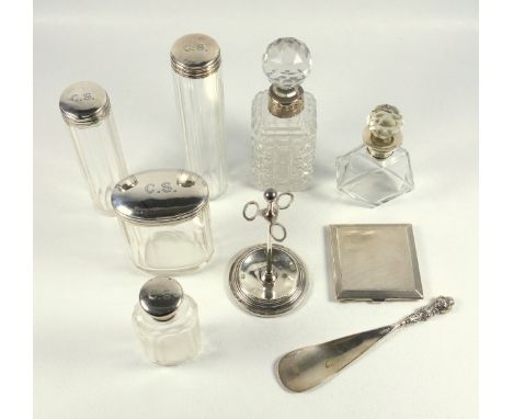 Three silver topped bottles by N Bros, Birmingham 1911, 3 silver mounted scent bottles, manicure stand, engine turned compact