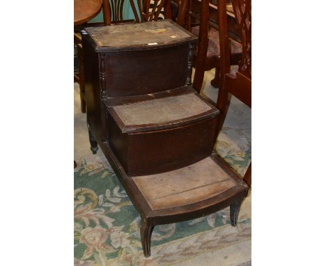 A George III mahogany bow fronted step commode, sabre legs.