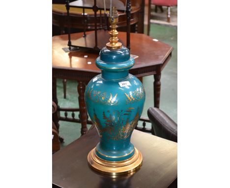 A large Chinese table lamp decorated with a gilt landscape on aqua green ground