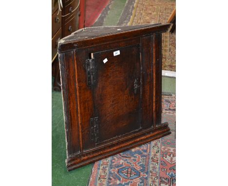 A 17th/18th century oak flat front corner cupboard, H hinge, double shelf interior