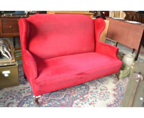 A wingback fireside sofa c1900