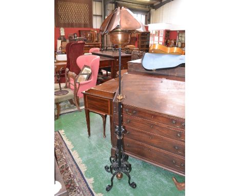 An early 20th century wrought iron an copper telescopic oil lamp (converted to electric).