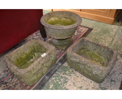 A pair of small moulded rectangular planters and a circular planter on pedestal