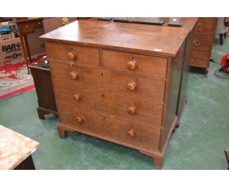 An oak chest of two short drawers  over three graduated long, button handles, ogee feet. 93cm high x 96cm wide.