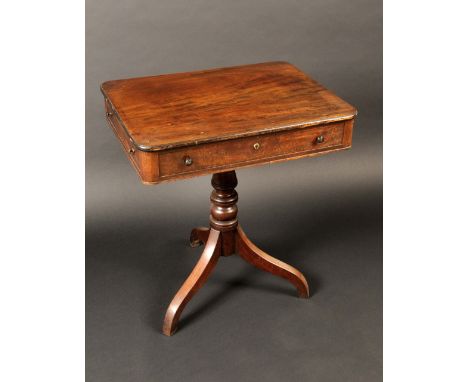 A George IV mahogany tripod pedestal side table, rounded rectangular top above a long frieze drawer, turned handles, turned c