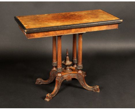 A Victorian burr walnut and ebonised rectangular card table, quarter-veneered folding top enclosing an inset baize lined play