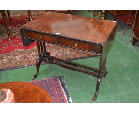 A George III style mahogany sofa table, cross banded top, two short drawers to frieze, turned stretchers and supports, cabrio