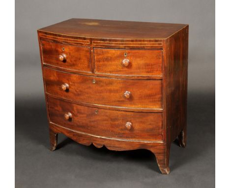 A small George III mahogany bow fronted chest of two short and two long drawers, turned handles, outlined throughout with box