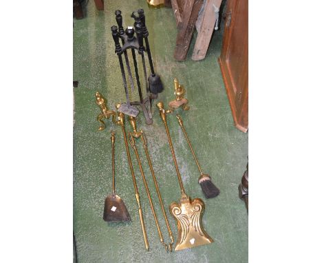 A 19th century brass three piece fire iron set, urn and ring handles, tongs, shovel and poker; a pair of similar and irons et