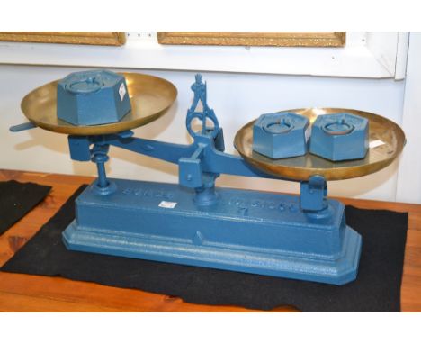A set of French cast iron weighing scales, painted blue with one 2kg weight and two 1kg weights.