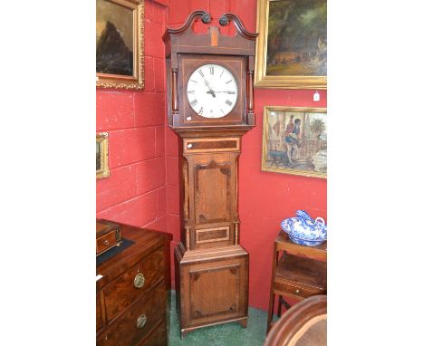 **Amended description**A William IV longcase clock case, oak with plentiful mahogany veneer with box inlay and burr elm panel