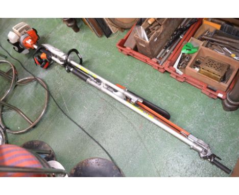 A Nordstrom Q2 petrol pole saw with hedge trimmer and chainsaw attachment.