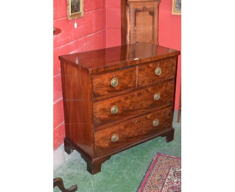 A George III mahogany chest of two short and two long graduated drawers, bracket feet, early 19th century