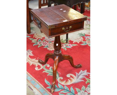 A George III writing stand, the bi-fold top opening to baize writing surface, wrought iron folding supports to sides, single 