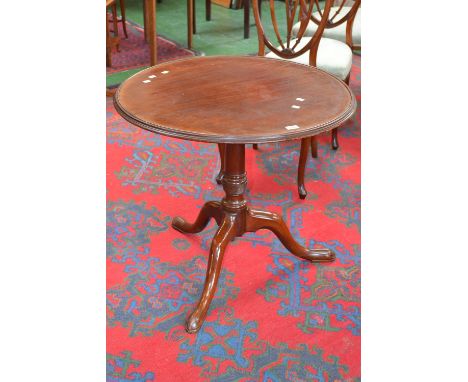 A Victorian mahogany tilt top tripod table, dished circular top, canon barrel column, spiral reeded socle,cabriole legs, pad 