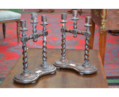 A pair of unusual Jacobean Revival oak tree-light table candelabra, barley twist and bobbin-turned, c.1925