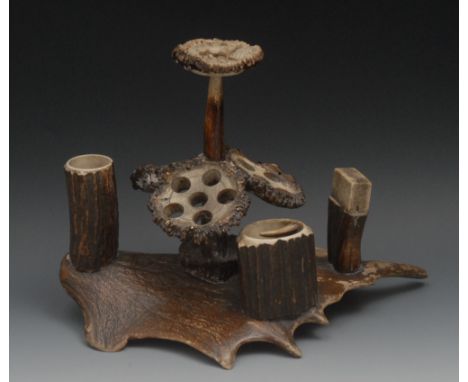 An unusual stag antler gentleman's hunting lodge smoking room compendium, the posted handle carved in relief with a deer, abo