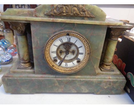 Victorian Onyx Mantel clock with visible escapement and column supports