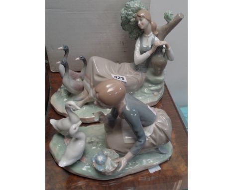 Boxed Lladro figure 'Cornida a los Patos' and another Lladro figure of a Woman recumbent with 3 Geese