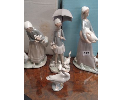 Lladro figure of a woman with goose and puppy, Lladro figure of girl with umbrella and ducks, Lladro woman with