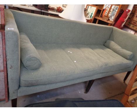 Large Green upholstered Georgian Sofa of rectangular construction on six tapering Elm legs on Brass casters