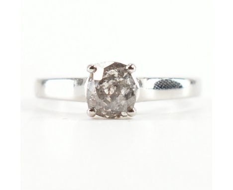 A hallmarked 950 white platinum &amp; diamond solitaire ring. The single stone ring having an old cushion cut diamond to trel