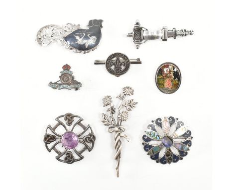 An assorted collection of silver brooch pins. The lot to include; an abalone &amp; blue stone set pierced design brooch, butt