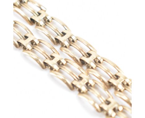 A vintage 9ct yellow gold fancy link bracelet chain. The chain comprised of rectangular pierced &amp; reeded fancy links &amp