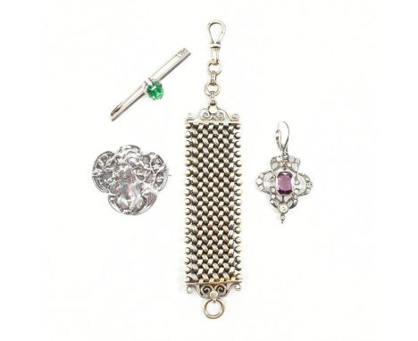 An assorted collection of silver brooch pins &amp; necklace pendant. The lot to include; a purple &amp; white stone set pierc