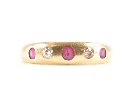 A hallmarked 18ct gold ruby and diamond ring. The ring being alternately set with three round cut rubies and two round cut di