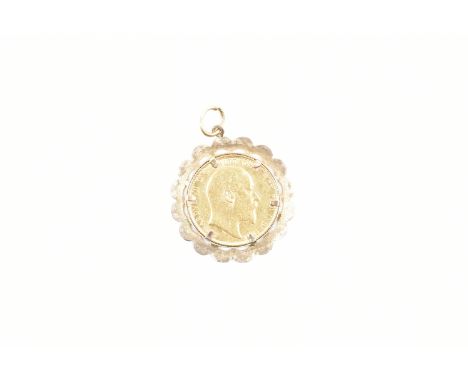 A 1910 sovereign coin in hallmarked 9ct yellow gold necklace pendant mount. The sovereign coin case within a scalloped, pierc