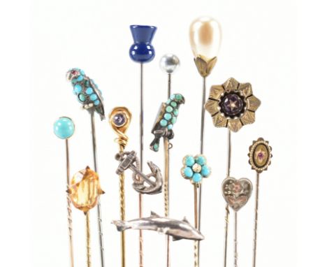 A collection of eight antique yellow and white stick pins. The pins to include gem set including turquoise and enamel birds, 