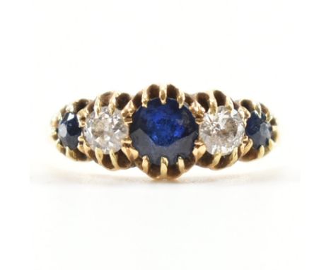 A gold sapphire and diamond 5 stone ring. The ring being set with three round cut sapphires and two round cut diamonds. Unmar