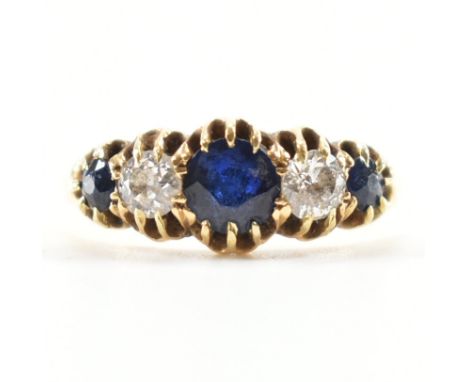 A gold sapphire and diamond 5 stone ring. The ring being set with three round cut sapphires and two round cut diamonds. Unmar