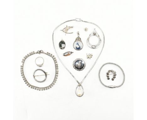 A collection of silver and white metal Jewellery. The jewellery to include brooches, pendant, necklace, pendants including de