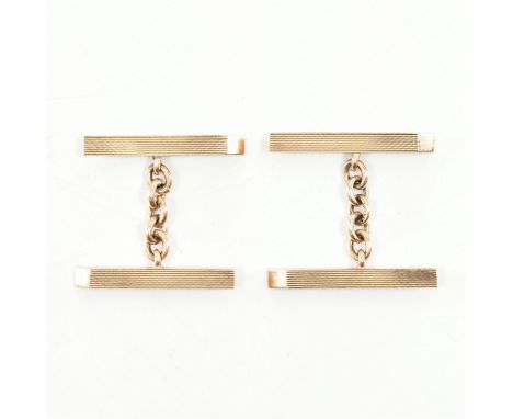 A pair of hallmarked 9ct yellow gold engine turned cufflinks. The cufflinks of elongated&nbsp;rhomboid shape &amp; decorated 