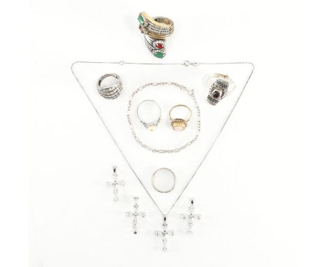 An assorted collection of silver jewellery. The lot to include; white stone set cross pendants on fine curb link necklace cha