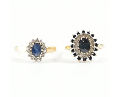 Two hallmarked 9ct gold sapphire cluster rings.&nbsp; A sapphire and diamond cluster ring set with a central oval cut sapphir