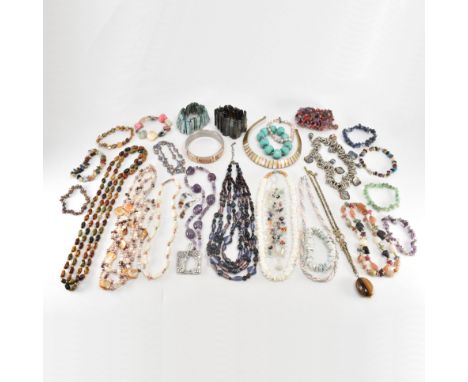 An assorted collection of stone &amp; shell jewellery. The lot to include; shell panel bangle bracelet, coloured mother of pe