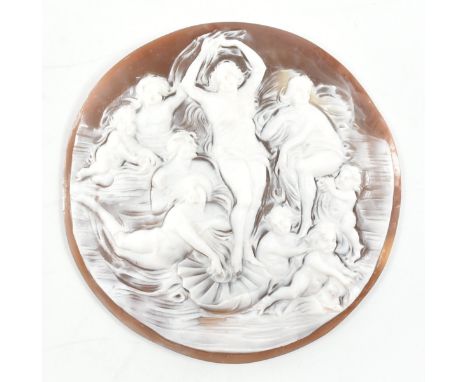 A vintage carved cameo shell. The cameo of circular form having a brown tone ground &amp; carving to the white shell to depic